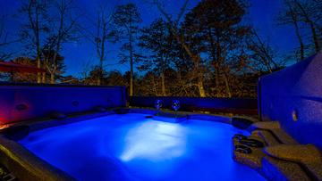 Romantic Tennessee Smoky Mountains cabin hot tub. at Stonehenge Cabin in Gatlinburg TN