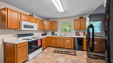 Enjoy snacks to family meals in your cabin kitchen. at Bear Crossing in Gatlinburg TN