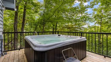 Your chalet's hot tub in Chaqlet Village where you can also enjoy three pools, tennis courts, arcades and more! at Chalet All Day in Gatlinburg TN