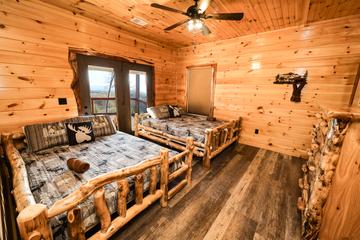 Log queen beds in the 3rd bedroom. at Sunset Peak in Gatlinburg TN