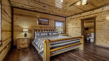 Bedroom One Of Eight First bedroom of your 8BR cabin in the Tennessee Smoky Mountains.