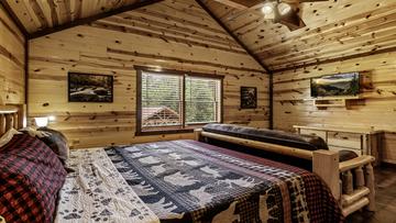 Seventh Cabin Bedroom With TV Watch those late night shows before trailing off to sleep.