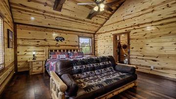 Cabin In The Smokies With Eight Bedrooms Eighth cabin beroom with King bed and sleeper futon.