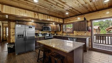Cabin Kitchen Island Plenty of extra seating is available at the kitchen island.