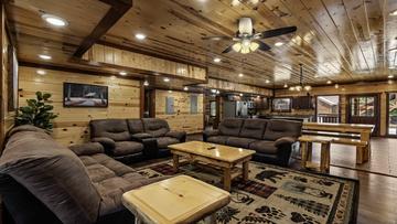 Living Room 8 Bedroom Pool Cabin In The Smokies Living room of your 8 bedroom cabin with a pool in the Smokies.