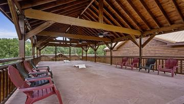 Covered Porch Above Pool The whole family can have fun under this massive covered porch.