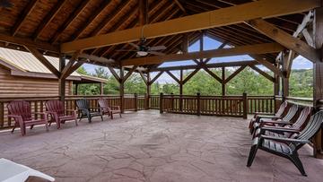 Cabin Fever Pool Cabin Upper Deck Smoky Mountains Cabin Fever pool cabin with a very spacious covered upper deck for family fun.