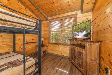 Bunk bedroom with television. at The Appalachian in Gatlinburg TN