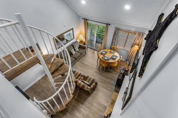 Cinderella staircase overlooking the living room of your condo. Cinderella staircase overlooking the living room of your condo.
