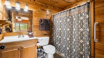 Your cabin's second bedroom with full bath.