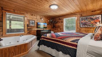 Smoky Mountains Cabin Second Bedroom Second bedroom with Jacuzzi tub in your Smoky Mountaina cabin getaway.