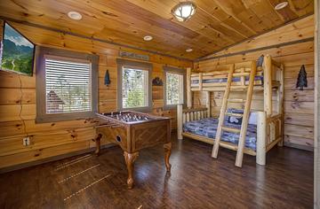 Foosball table, bunk beds and television. at A Point of View in Gatlinburg TN