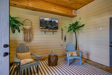 Seating next to your private in-cabin swimming pool. at A Point of View in Gatlinburg TN